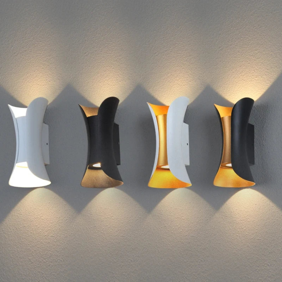 Curved wall light casting light upwards and downwards on an exterior wall