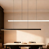 Linear LED pendant light above a modern kitchen island