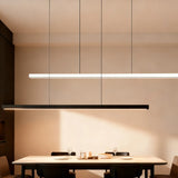 Linear LED pendant light above a modern kitchen island