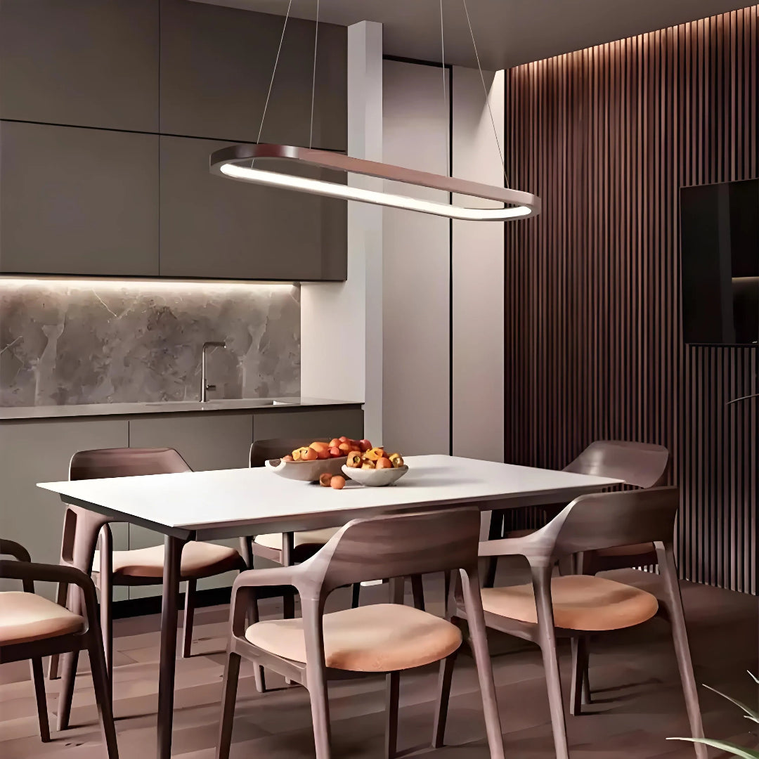 Dark wood oval LED pendant above a dining table