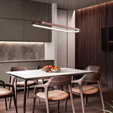 Dark wood oval LED pendant above a dining table