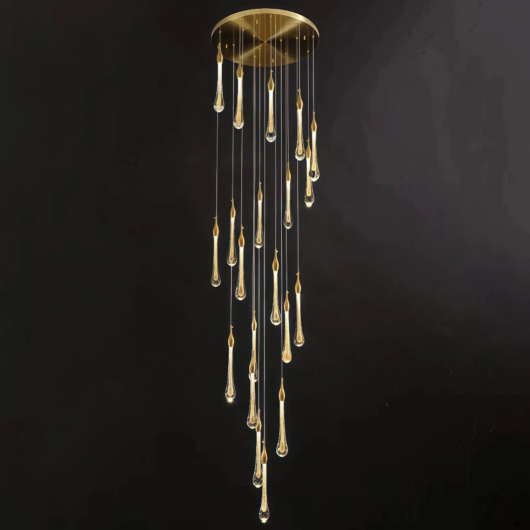 Gold teardrop crystal chandelier with a round ceiling canopy
