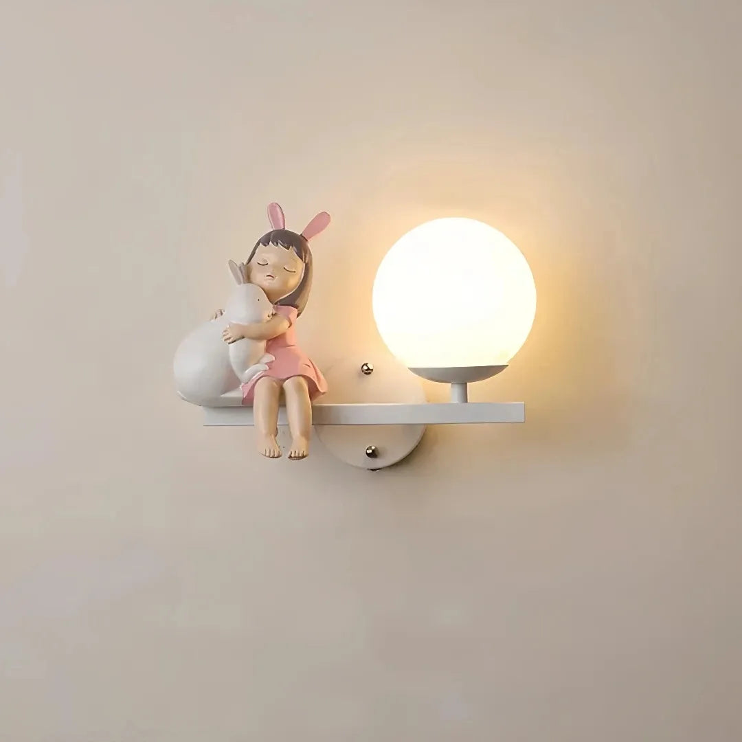 Children's wall light creating a soft glow beside a bed