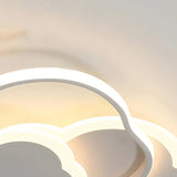 White cloud-shaped ceiling light illuminated with warm white light