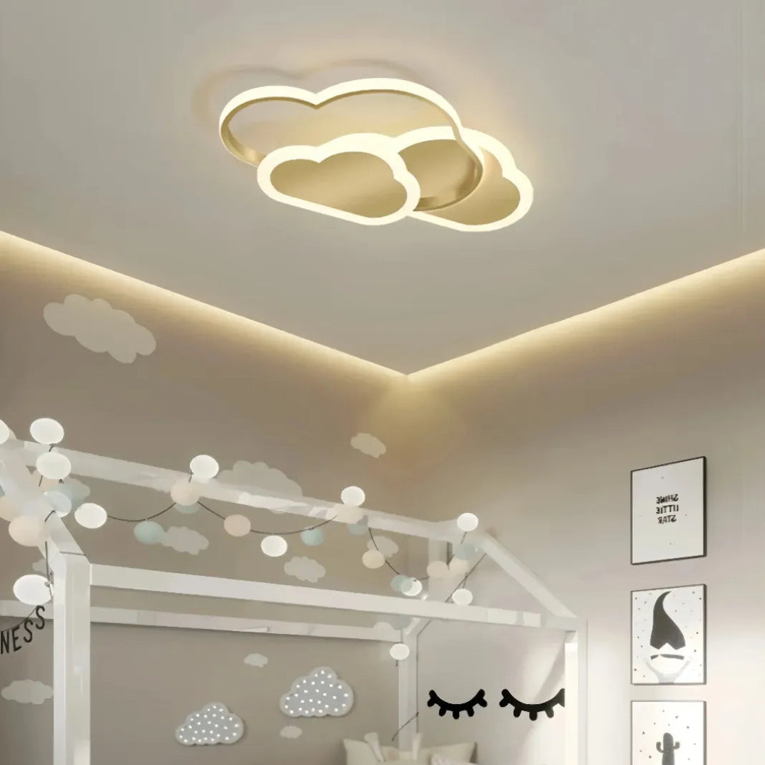 Gold cloud-shaped flush LED ceiling light for a children’s bedroom