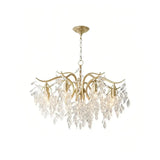 Close-up of textured crystal leaves on a gold chandelier
