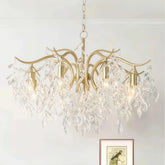 Gold crystal leaf chandelier above a dining table