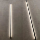 Hardwired installation detail for a black indoor LED wall light
