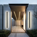 Slim black metal outdoor wall light with acrylic diffuser
