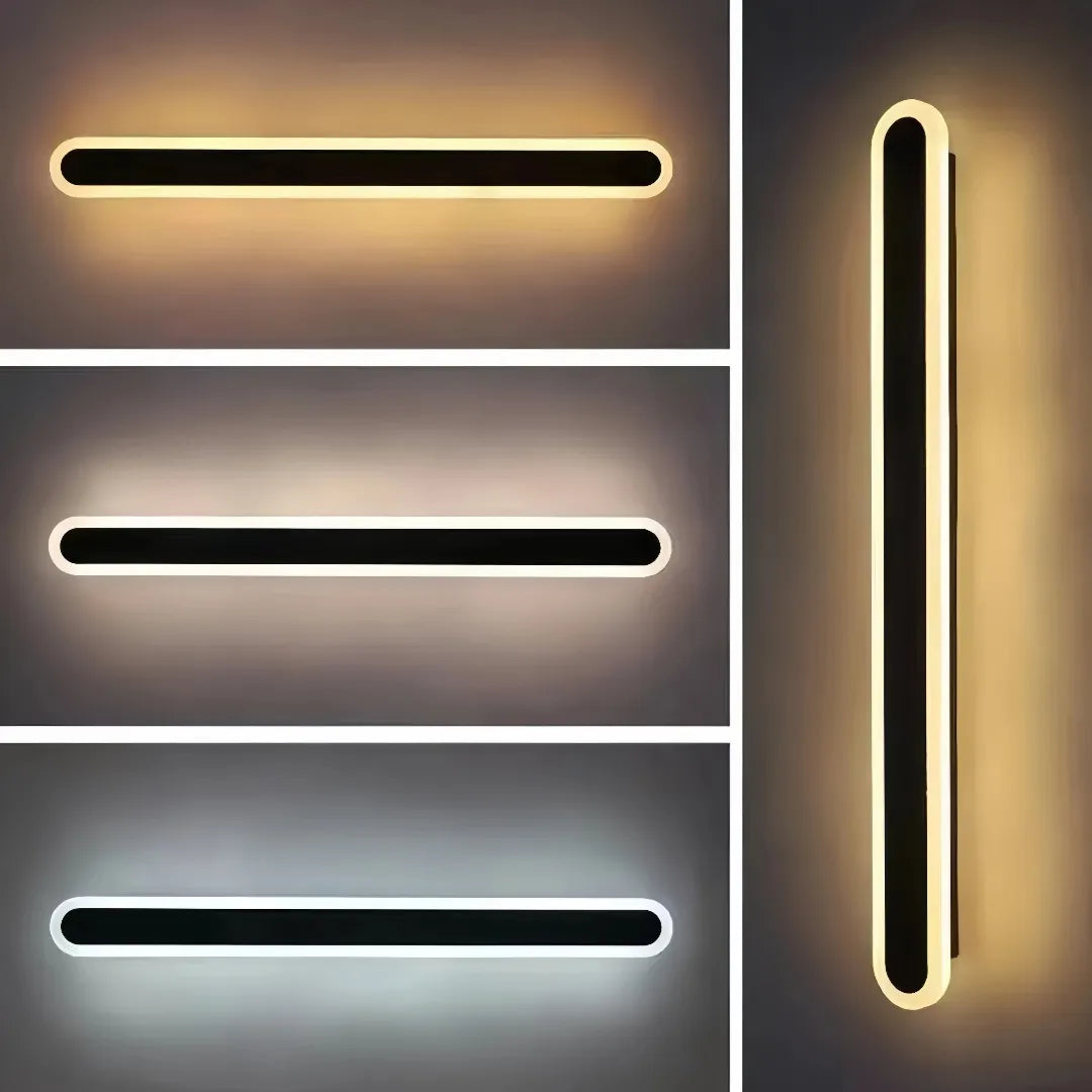 IP65 black wall light illuminating an exterior wall