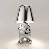 Gold touch bedside table lamp on a bedroom side table