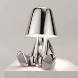 Gold touch bedside table lamp on a bedroom side table