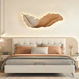 Orange feather-shaped LED wall light