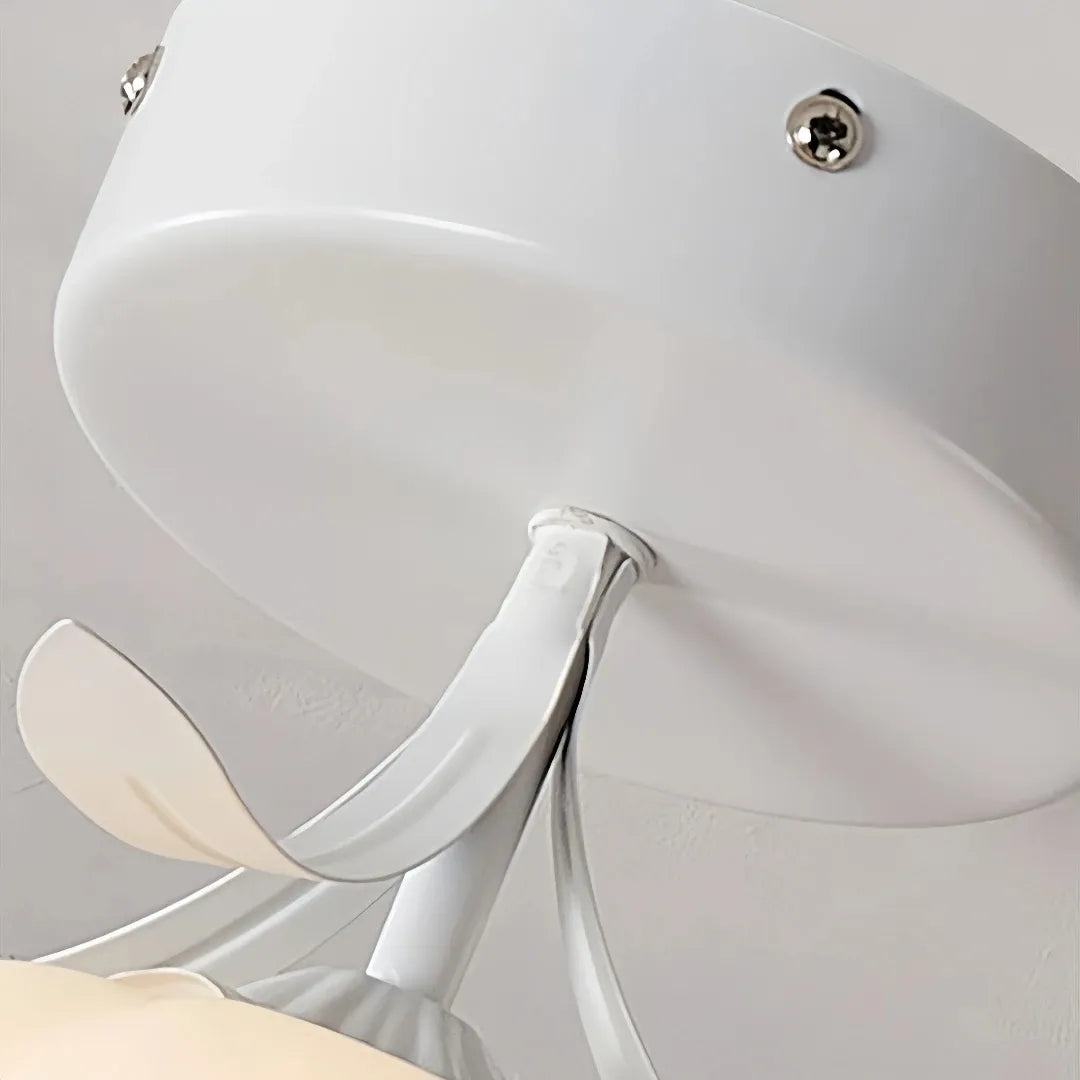 Close-up of flower-shaped glass shade and metal ceiling fitting