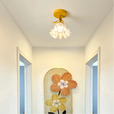 Yellow flower-shaped glass shade on a ceiling light