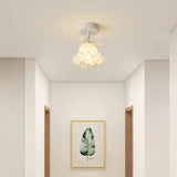 Semi-flush ceiling light with delicate flower-shaped glass shade