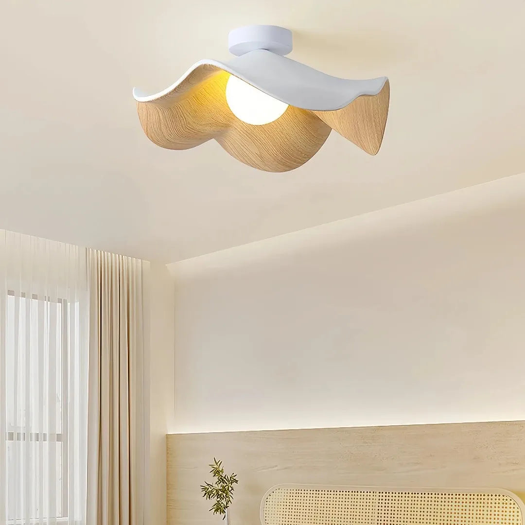 White and wood lotus leaf LED flush ceiling light installed in a modern bedroom