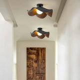 Modern lotus leaf ceiling light installed in an indoor hallway