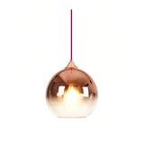 Modern glass globe pendant light in a gold finish
