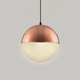 Rose gold pendant light with clear patterned glass shade