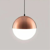 Rose gold pendant light with a frosted glass globe shade