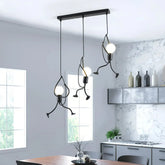 Black 3-light little man pendant with a linear ceiling plate