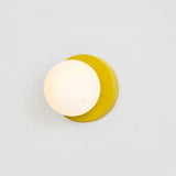 Modern glass globe wall light in yellow finish