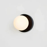 Side view of the black glass globe wall light