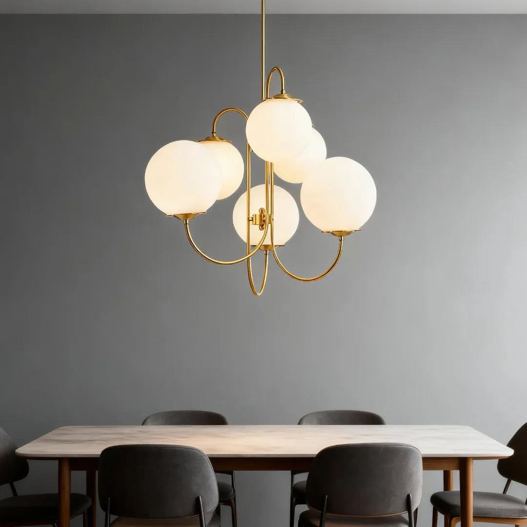 Six-light glass globe chandelier above a dining table