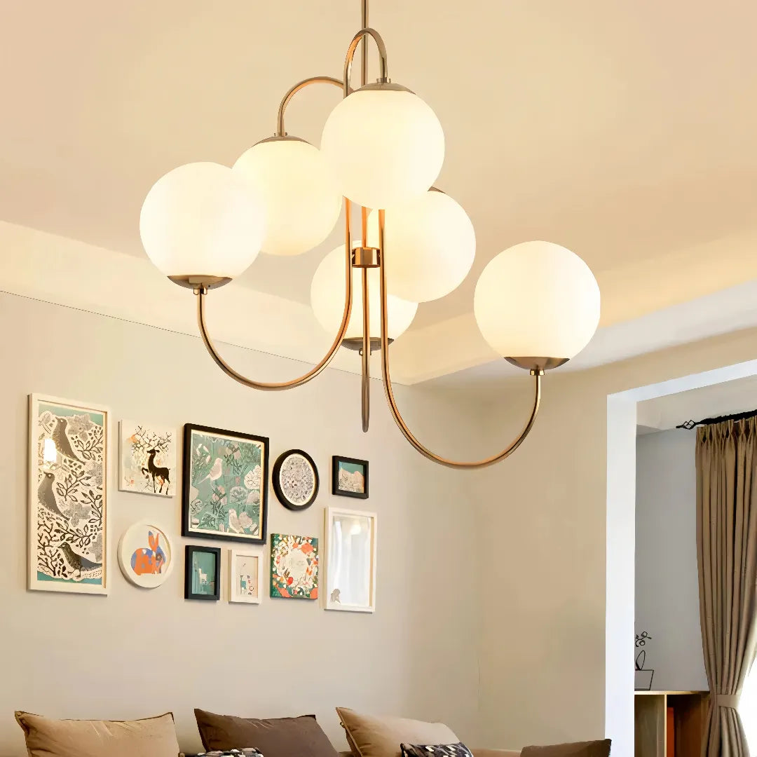 Opal glass globe chandelier in a living room with a gallery wall