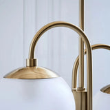 Close-up of a curved metal arm and an unlit glass globe