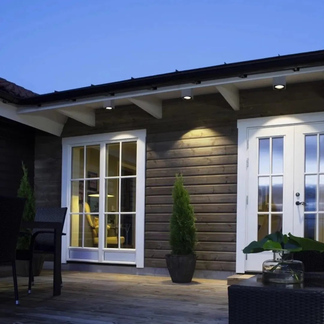 Surface-mounted outdoor ceiling light installed on a covered balcony