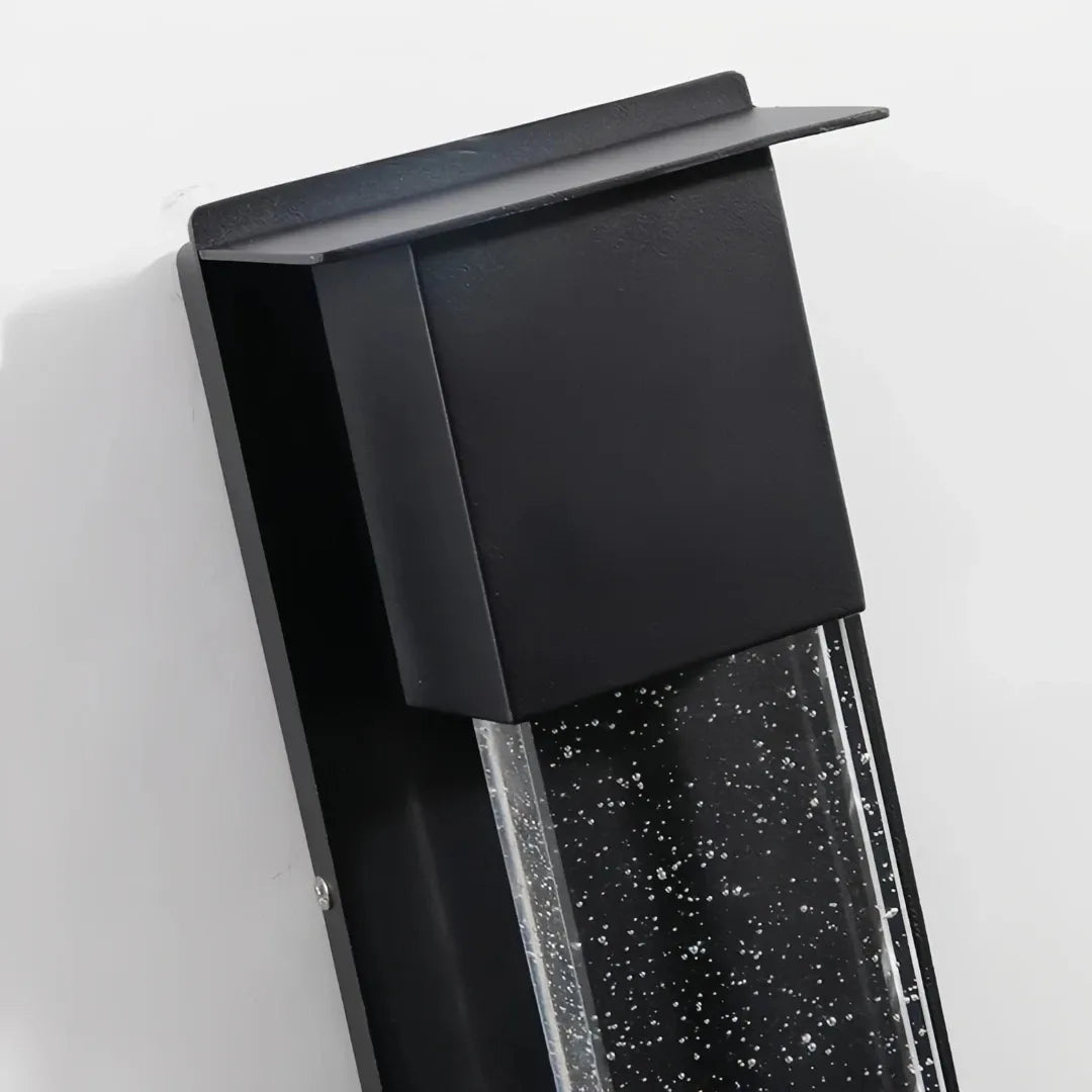 Close-up of the upper black housing on the outdoor wall light