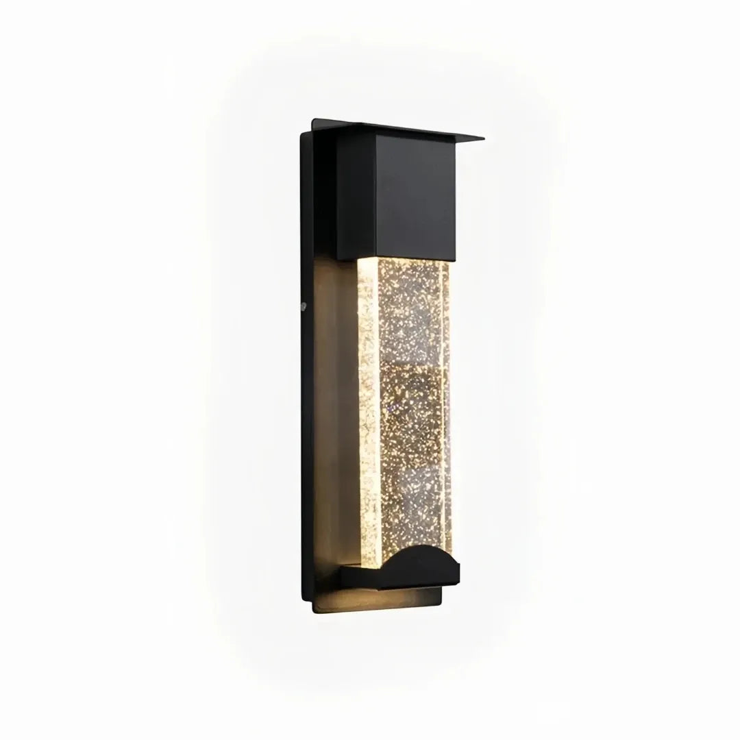 Detail of the black wall light housing and bubble-textured crystal glass panel
