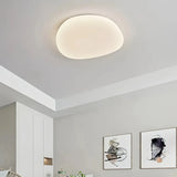 Dimmable white LED flush ceiling light illuminated in a bedroom
