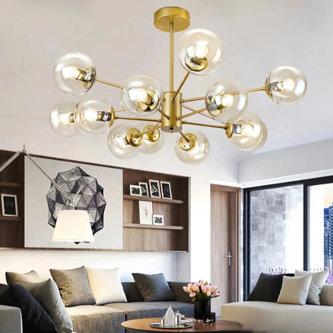 Gold 12-light Sputnik chandelier with clear glass globes in a living room