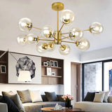 Gold 12-light Sputnik chandelier with clear glass globes in a living room