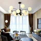 Black Sputnik chandelier with white glass globes in a living room