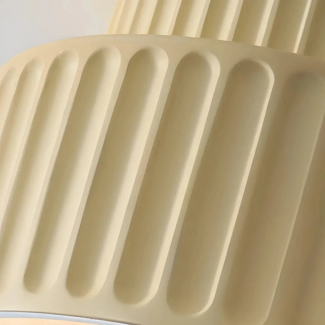 Close-up of the ribbed resin shade on a cream flush ceiling light