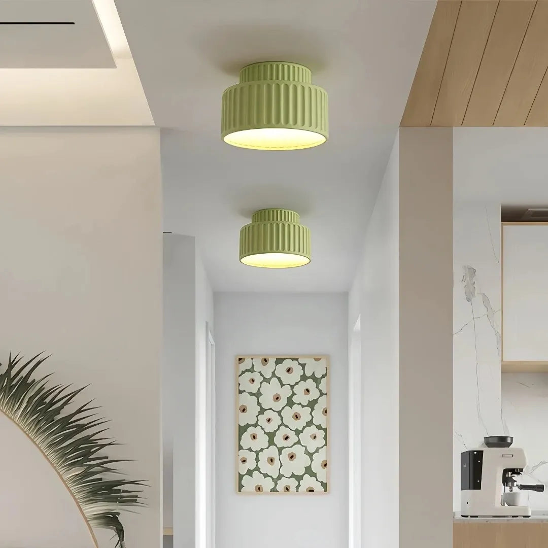 Cream ribbed ceiling light producing warm white light