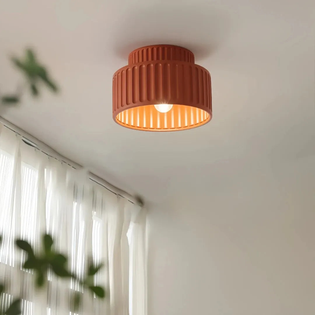 Cream ribbed ceiling light above a contemporary living room