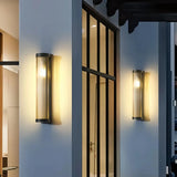 Modern outdoor wall light installed beside a porch entrance