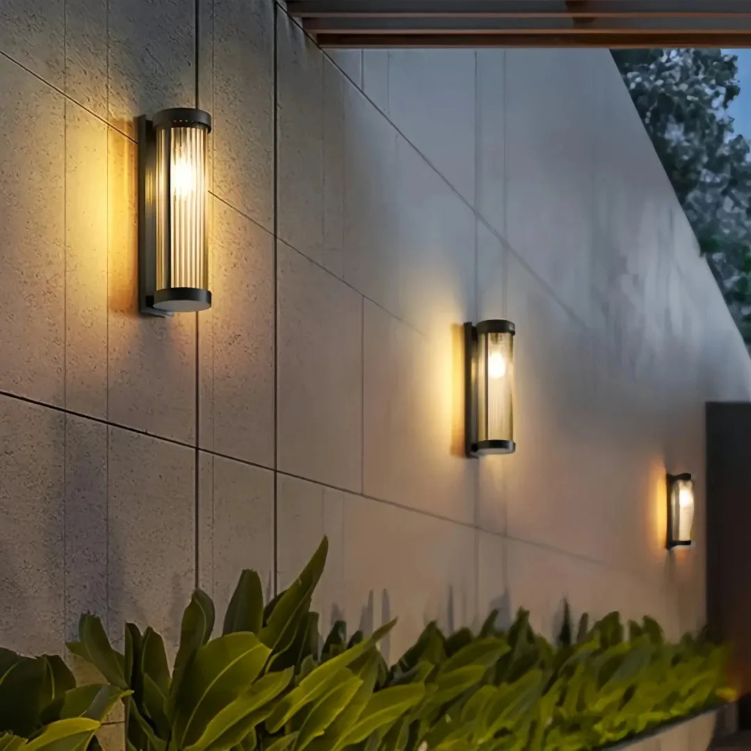 Modern outdoor wall light installed beside a porch entrance