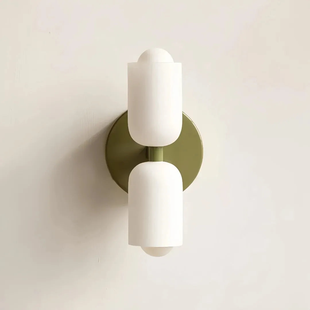 Close-up of the opal glass shade on a Nordic bedside wall light