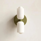 Close-up of the opal glass shade on a Nordic bedside wall light
