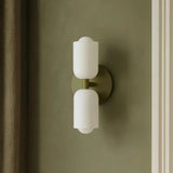 Side view of a hardwired indoor bedside wall light