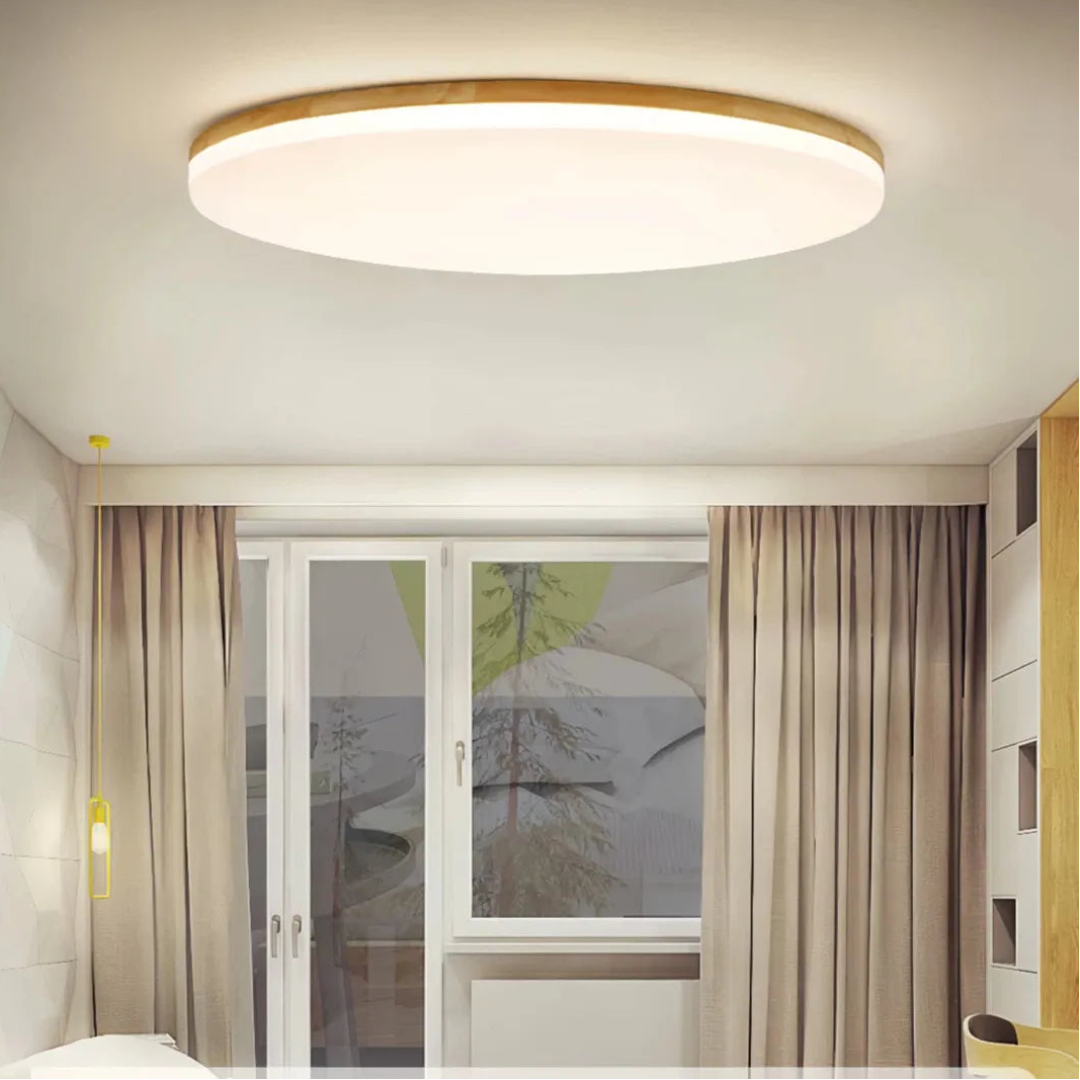 Round wooden ceiling light viewed from below