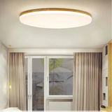 Round wooden ceiling light viewed from below