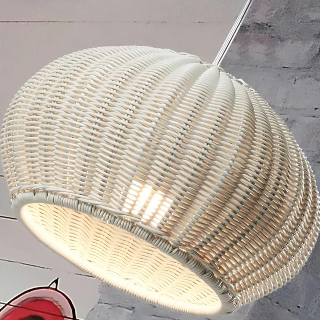 Close-up of the woven rattan shade on an outdoor pendant light