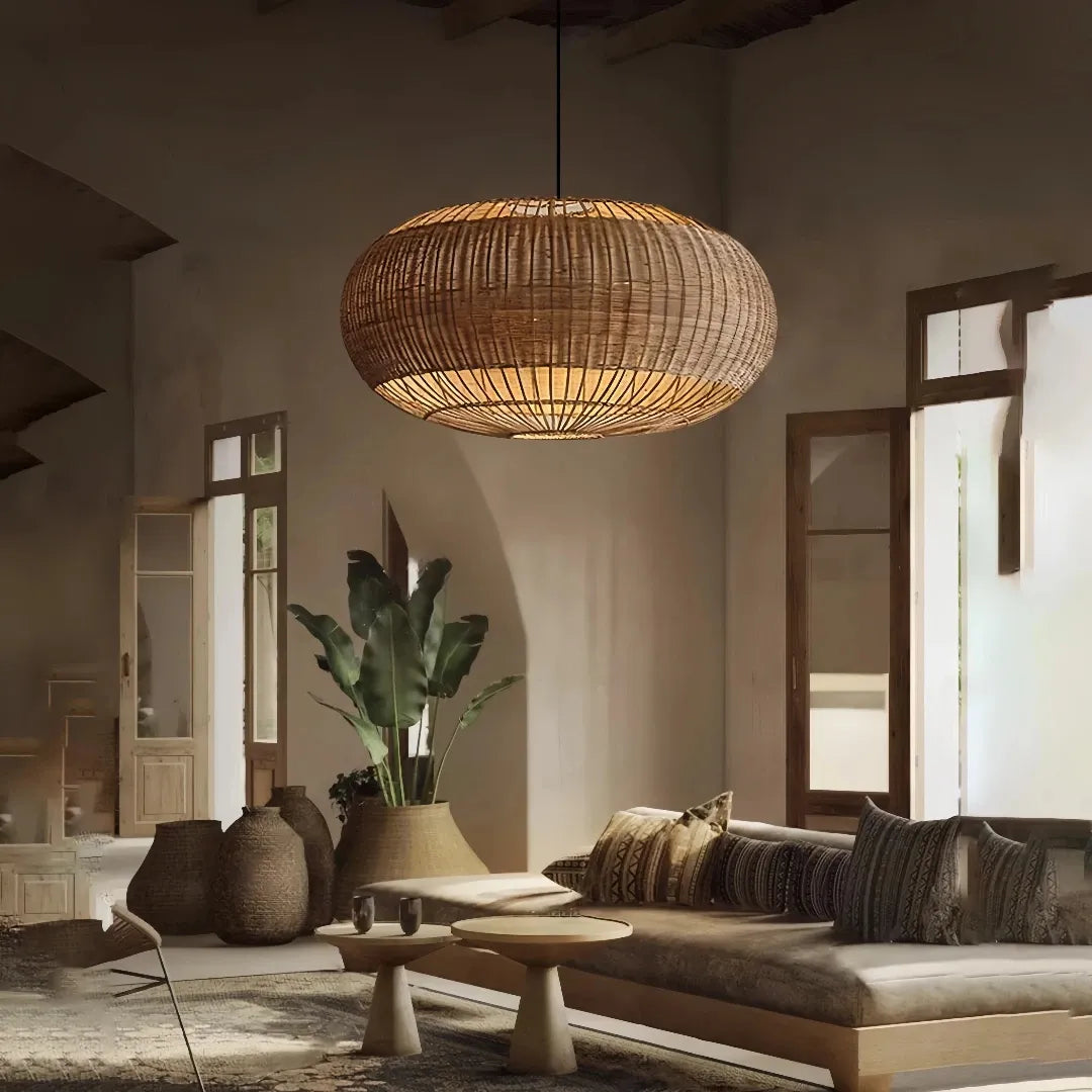 Oval rattan pendant light above a sofa in a living room